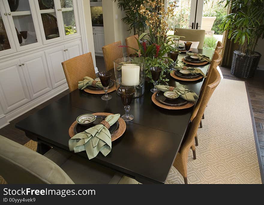 Luxury home dining table with modern tableware. Luxury home dining table with modern tableware.