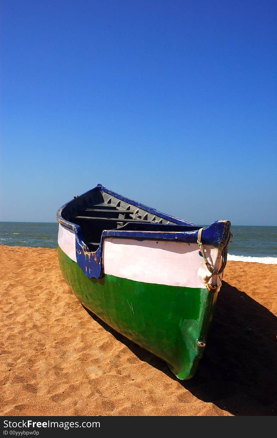 A fishing boat on the sea beach at Gujarat-India. A fishing boat on the sea beach at Gujarat-India.