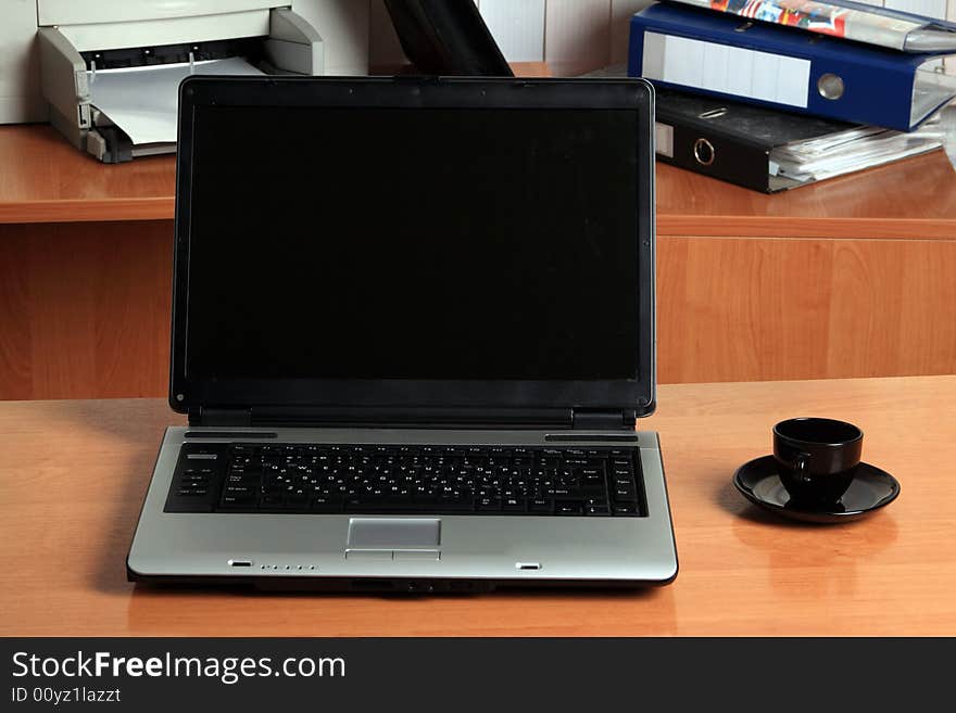 Laptop and mousy close up at office on a table