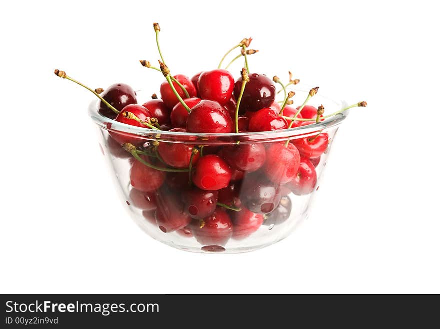 Red cherries in glass cup