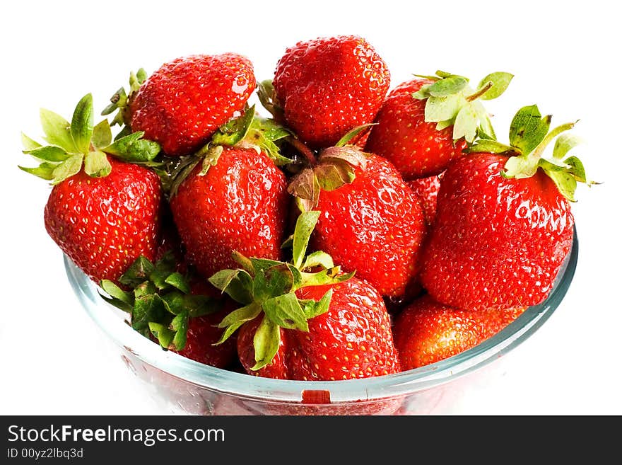 An image of glass cup with strawberries