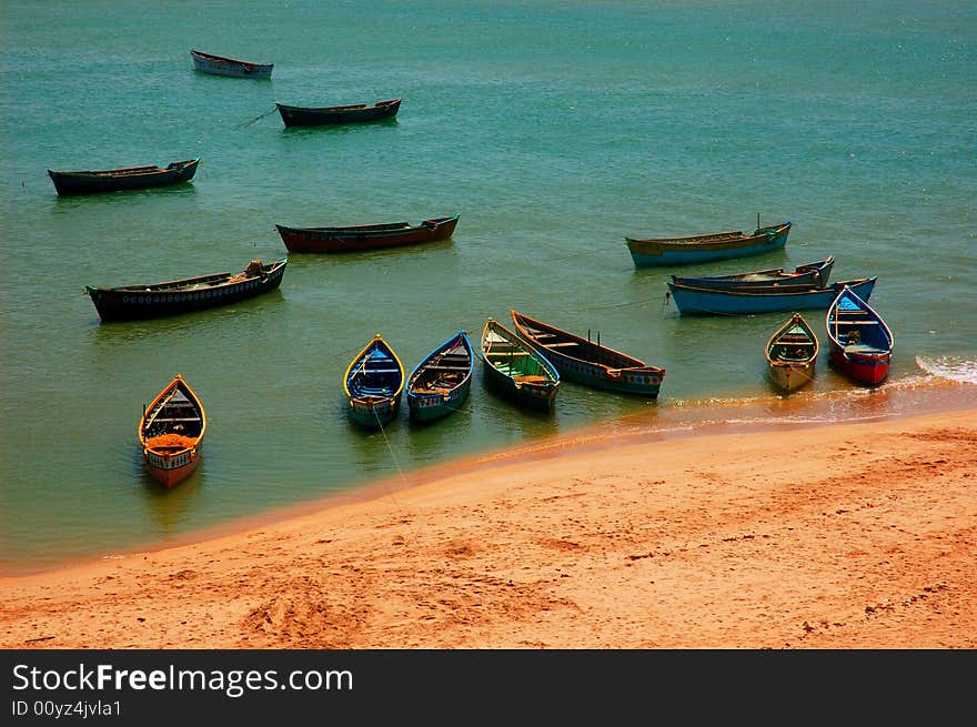 Fishing boats docked in sea. Fishing boats docked in sea.