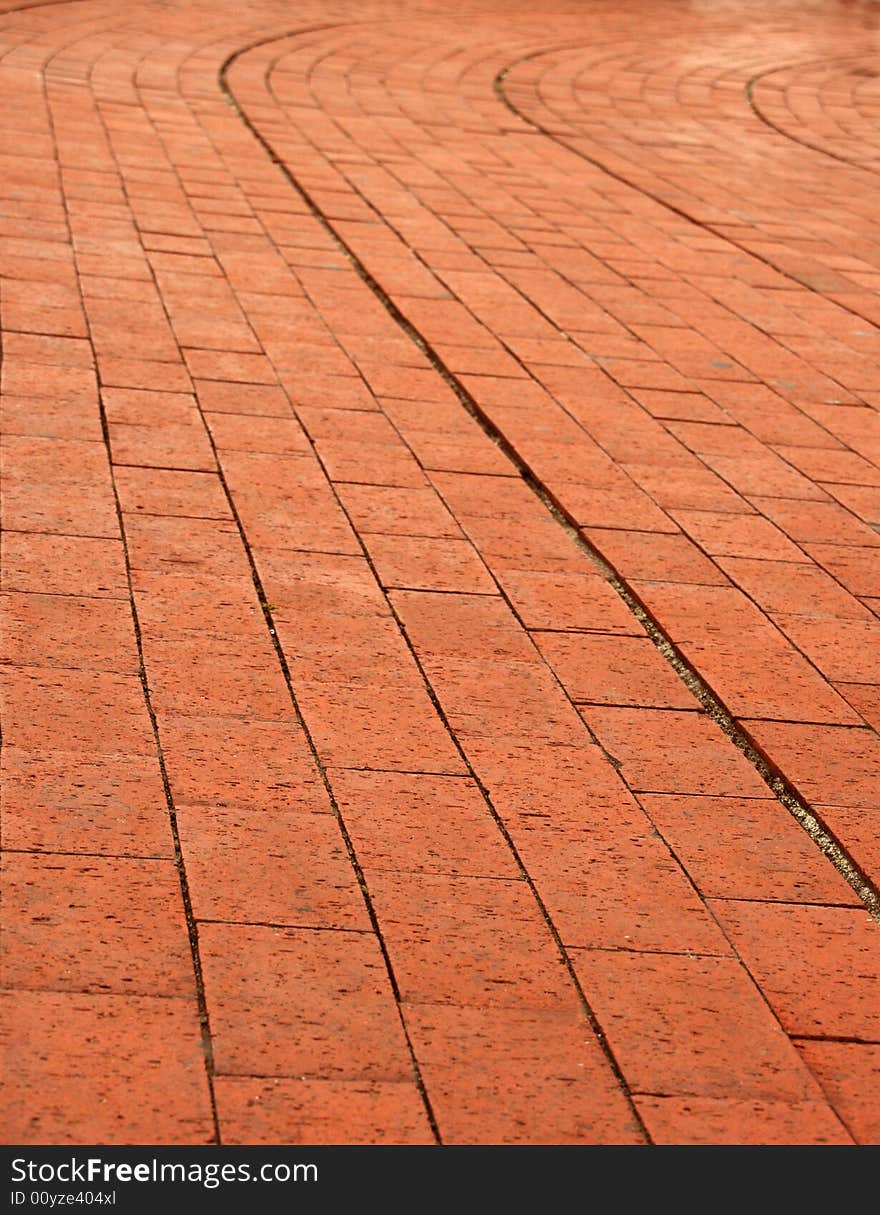 Background of a curve red orange brick wall. Background of a curve red orange brick wall