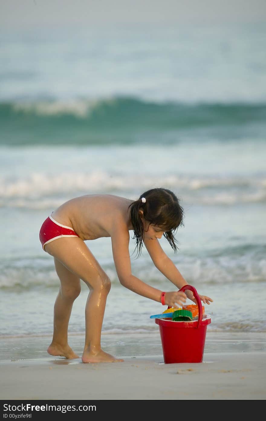 Little child play with sand