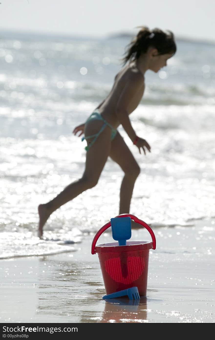 Little child play with sand