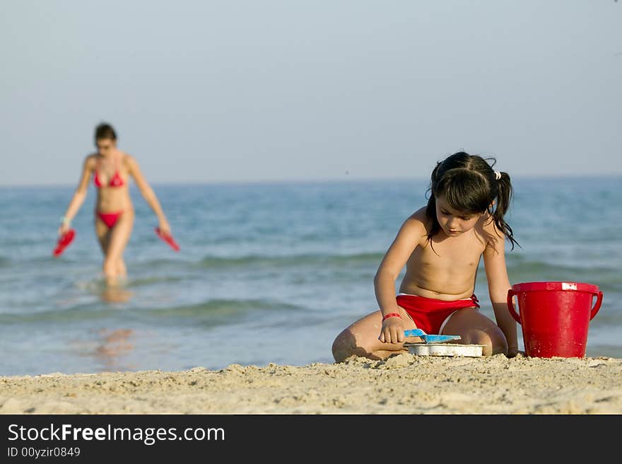 Little Child Play With Sand