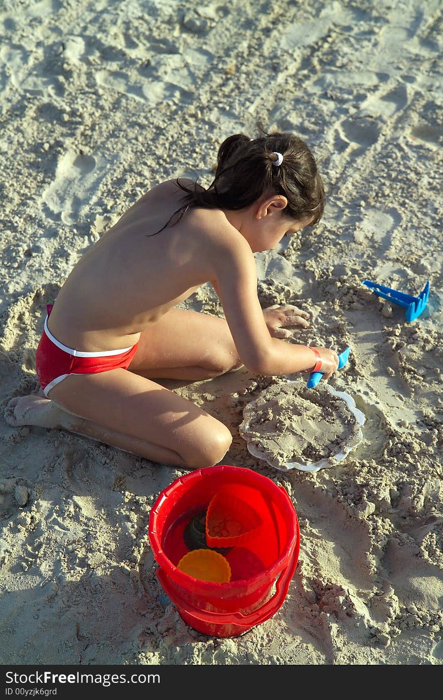 Little Child Play With Sand