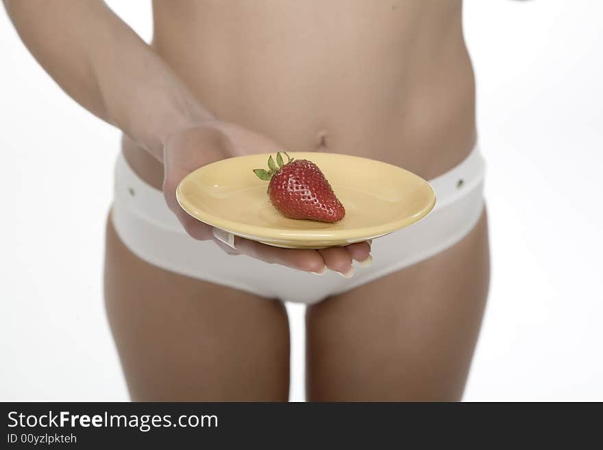 Young female holding a strawberry. Young female holding a strawberry