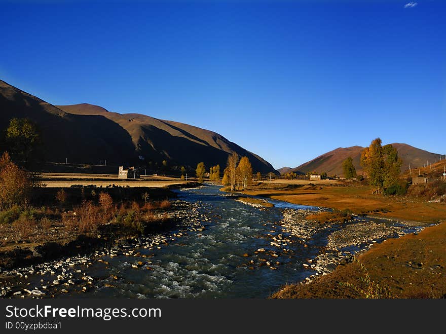 Small village with blue air under sunset,. Small village with blue air under sunset,