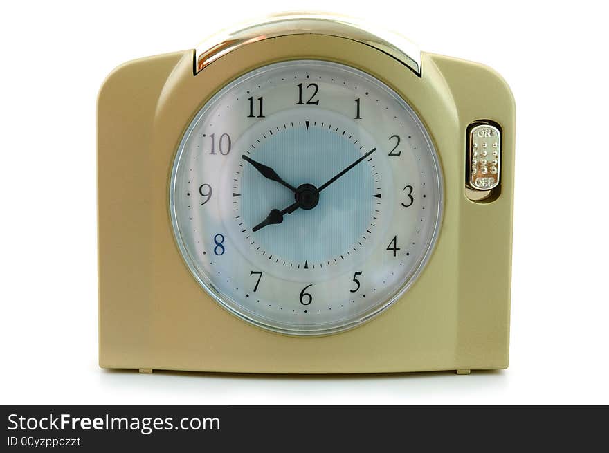 Alarm clock (with gold plastic body) on overwhite background. Alarm clock (with gold plastic body) on overwhite background.