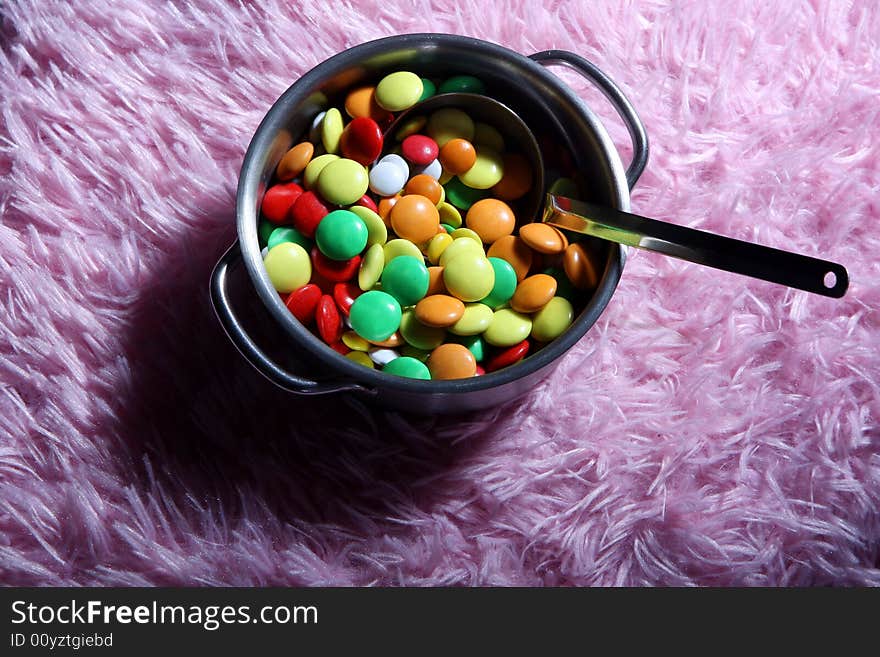 Many colored candies on a carpet