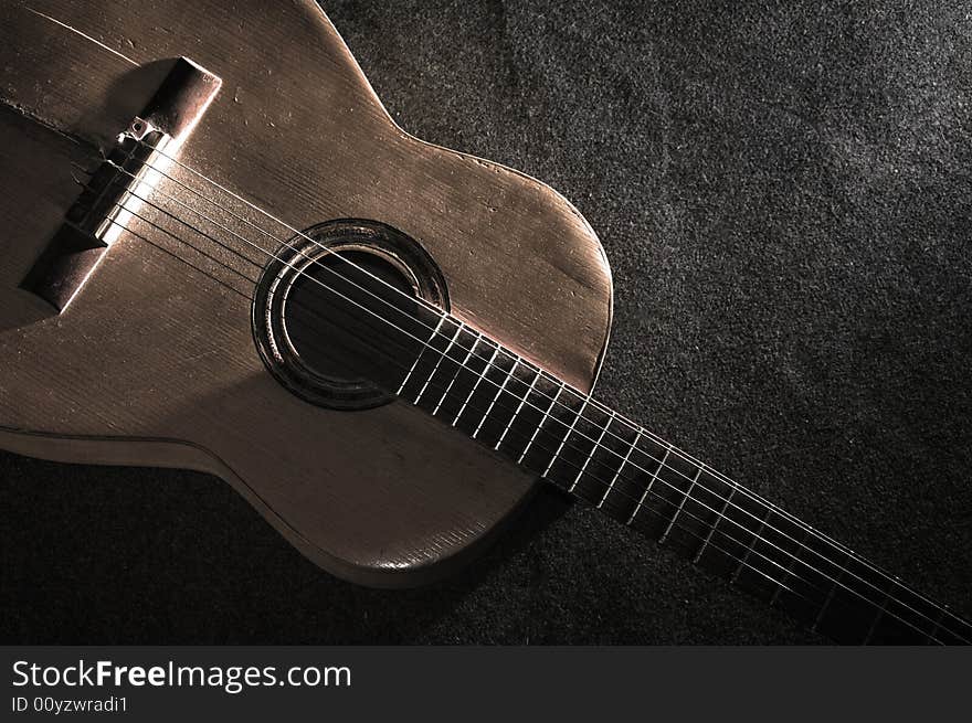 Still life with old acoustic guitar