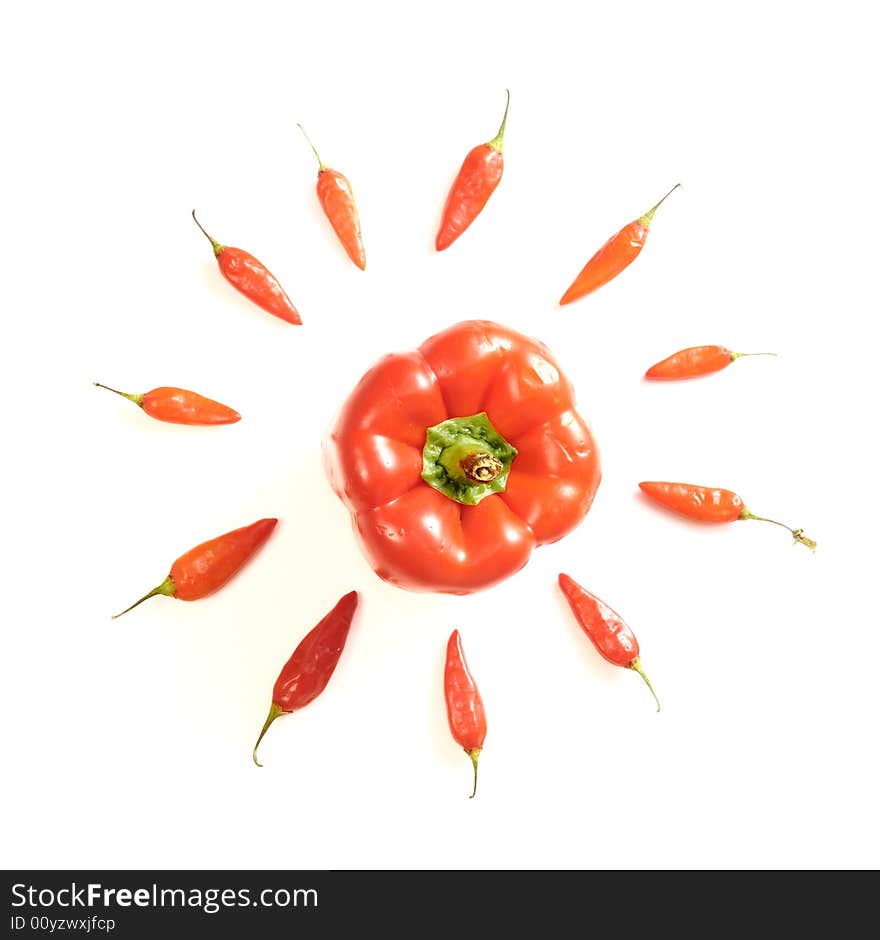 Arrangement of red peppers isolated over white