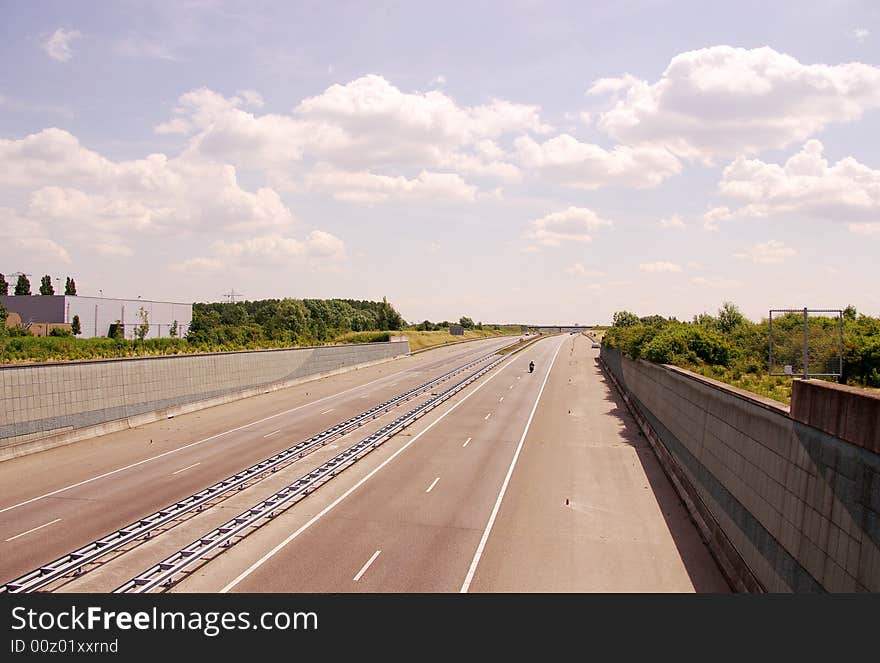 A very quiet highway at a sunny afternoon