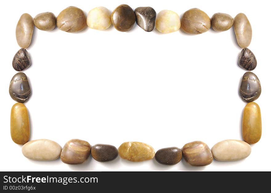 Assorted pebbles forming and border over white background. Assorted pebbles forming and border over white background