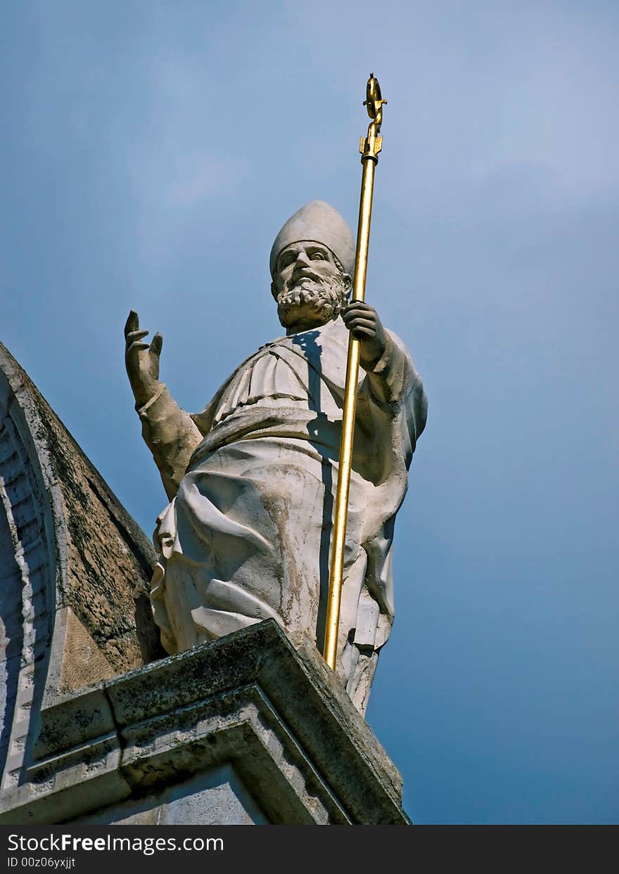 Statue of saint on a antique church