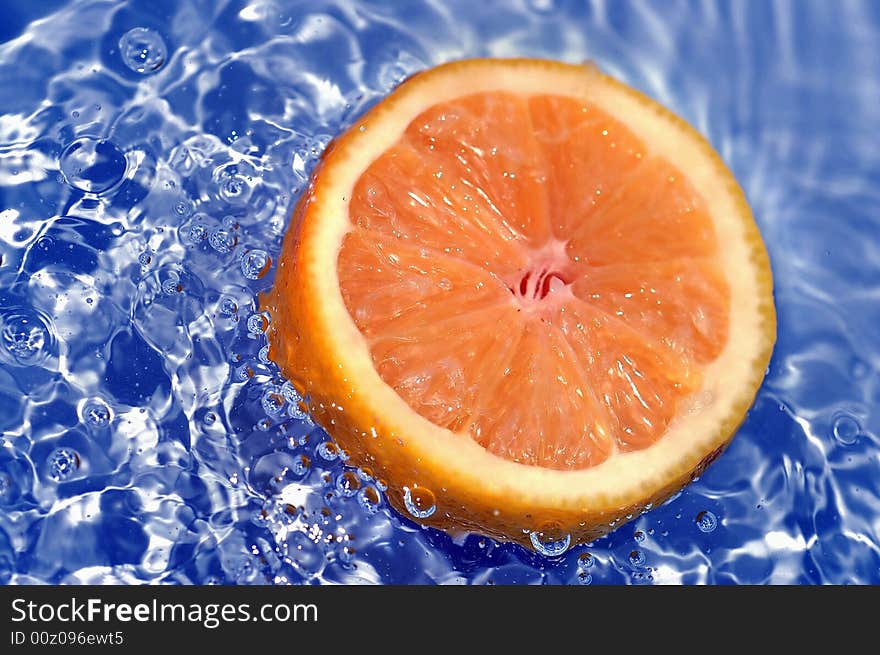 Fresh orange in water