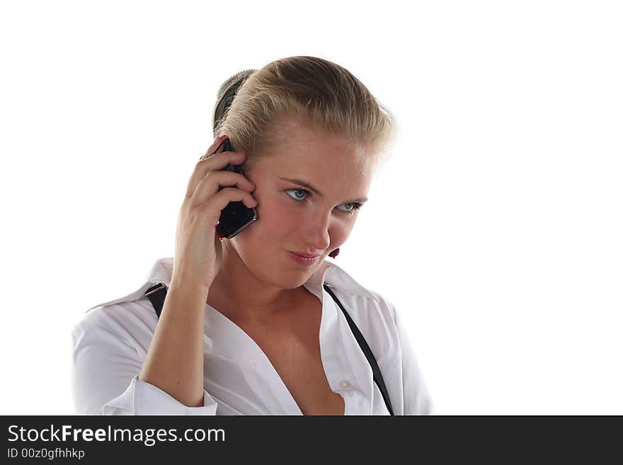 Blond woman talking by mobile phone unhappy