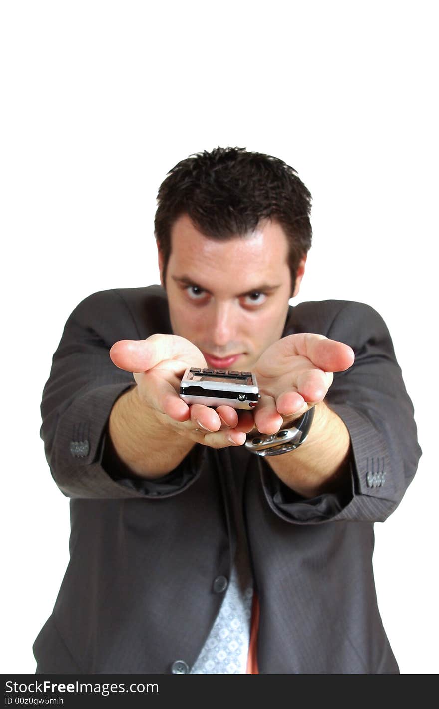 A young businessman, holding a cellphone(mobile) on his spread palms with hands pointing far forward. A young businessman, holding a cellphone(mobile) on his spread palms with hands pointing far forward