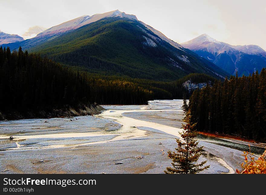 Glacier river in the mountains in the late fall