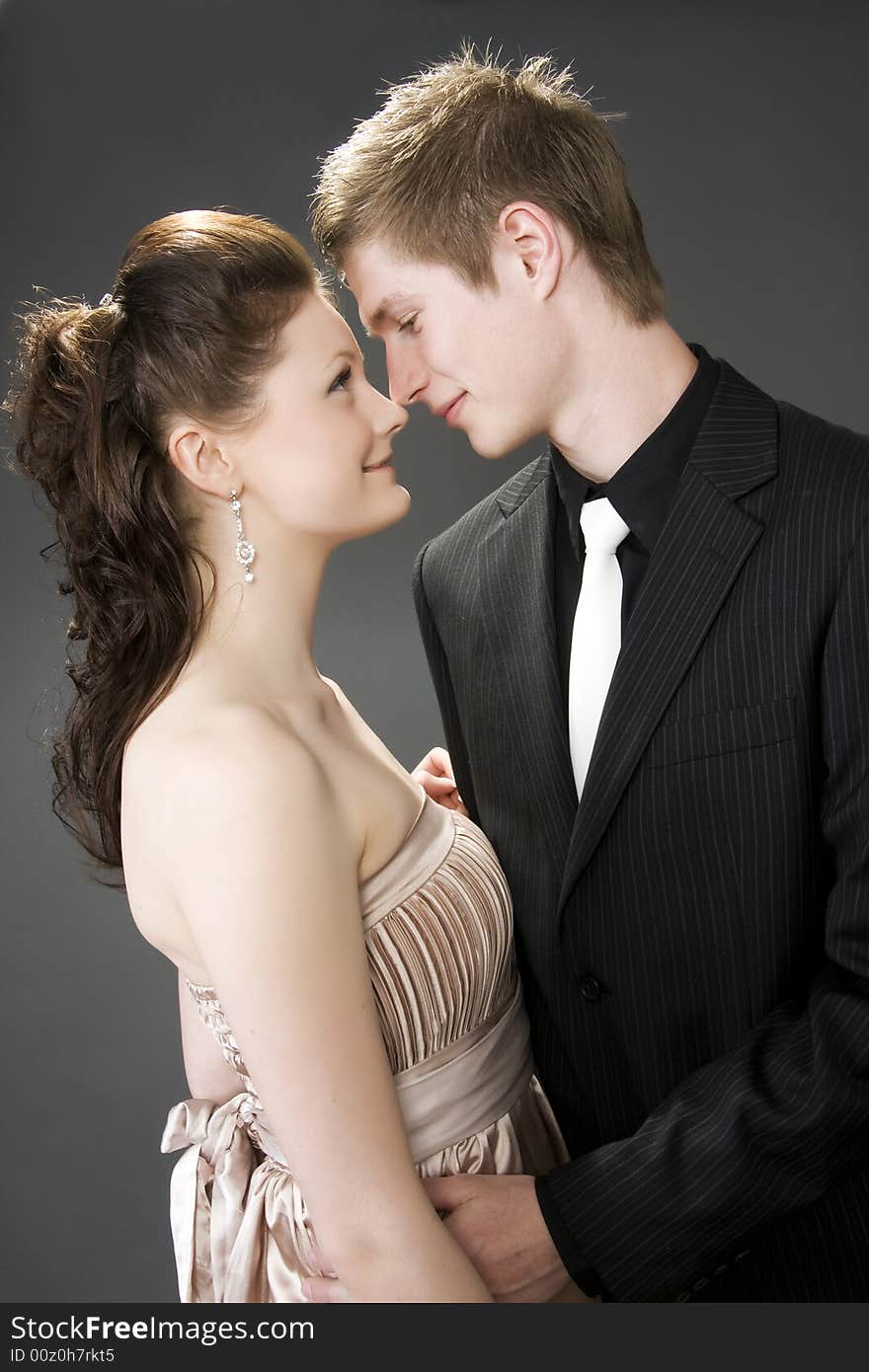 Portrait of a young beautiful couple embracing.