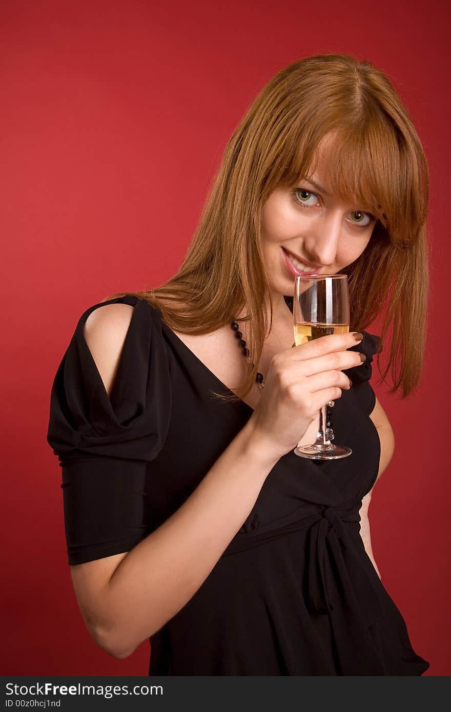 Beautiful girl with champagne glass isolated on red background