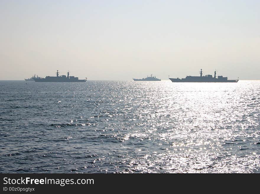 Fully loaded oil tanker and container carrier in the sun, on sea. Fully loaded oil tanker and container carrier in the sun, on sea.