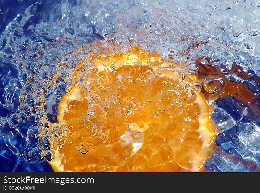 Fresh orange in the water