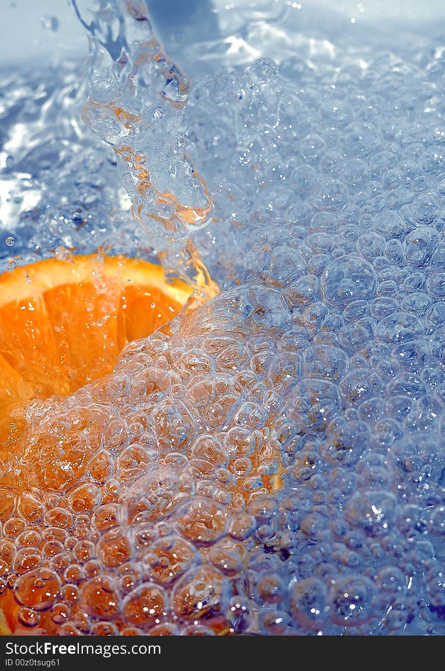 Fresh orange in the water