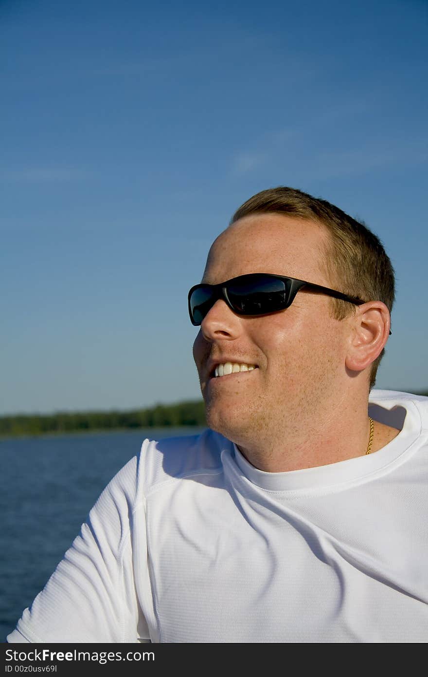 Young Male Riding On A Boat