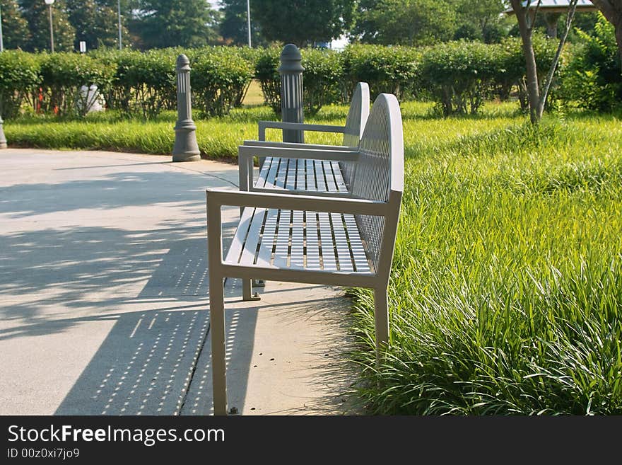 Park benches situated in a beautifully landscaped park.