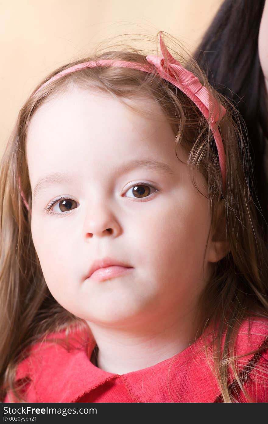 Portrait of a little girl with bow knot on head