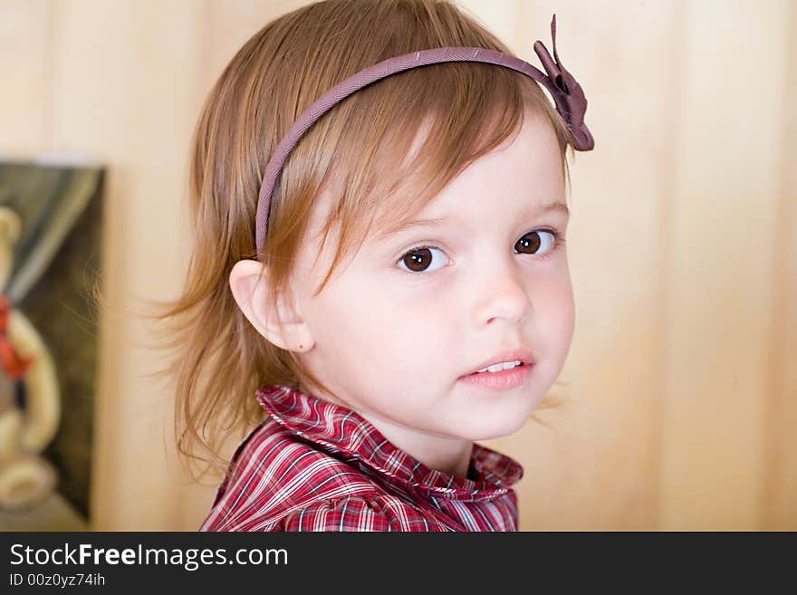 Portrait of a little girl with bow knot on head