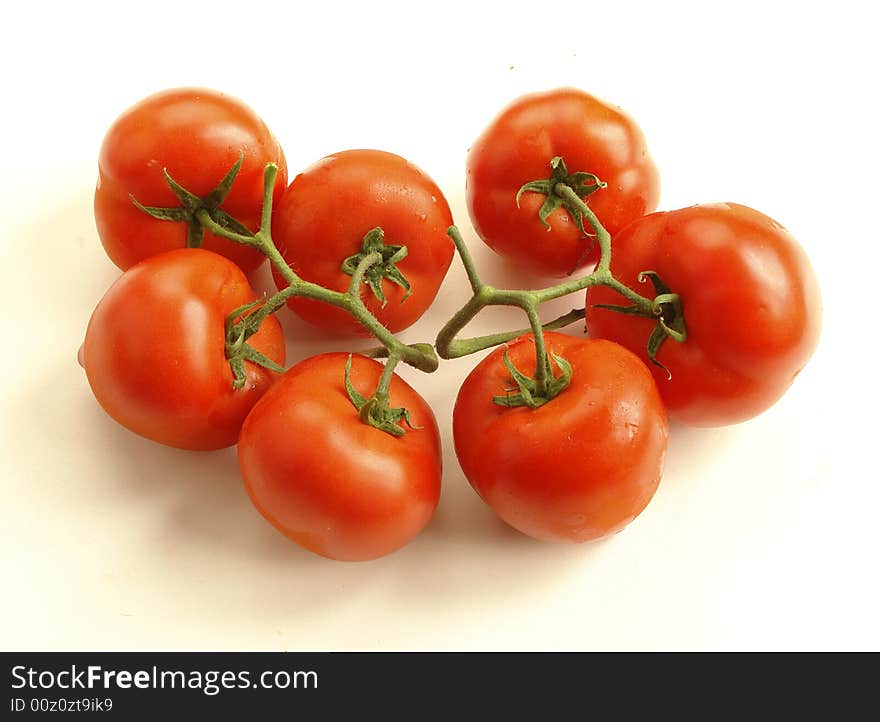 Fresh tomatoes on white background