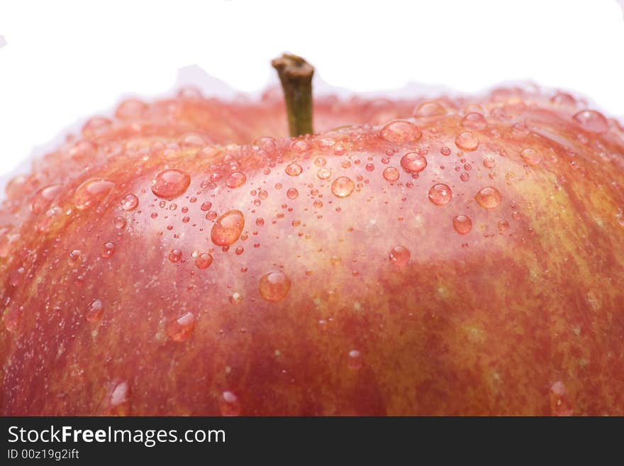 Red apple with water drops on white background