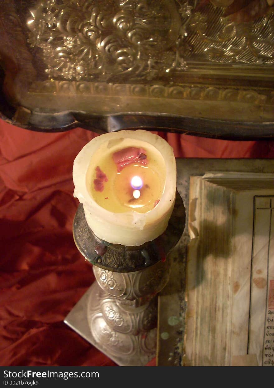 Religion still life with candle and candlestick