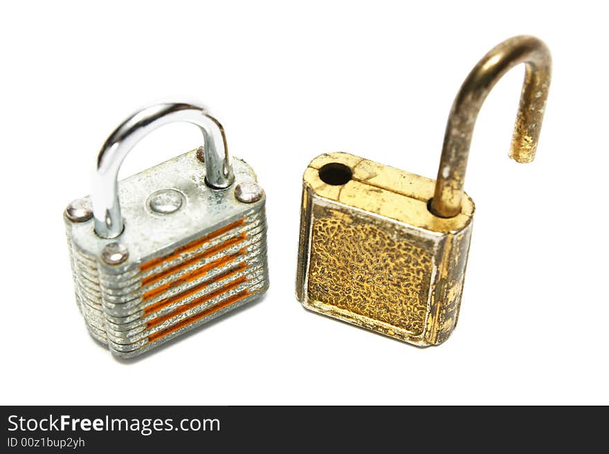 Two rusty locks standing on white background.