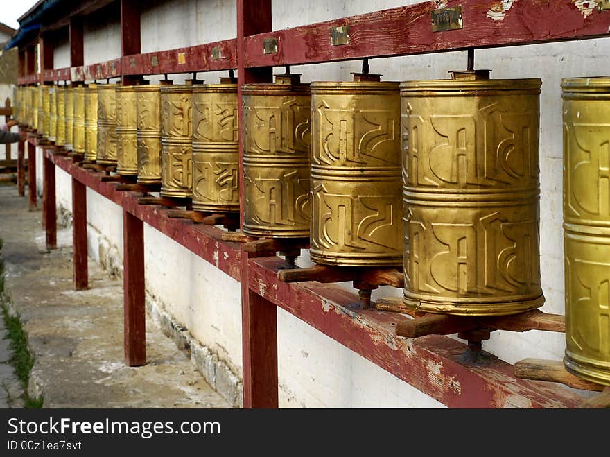 Prayer wheels mounted along the wall of one temple at Erdenzuu Monastery, which is on the site of Genghis Khan's original palace in Kharakorin, Mongolia