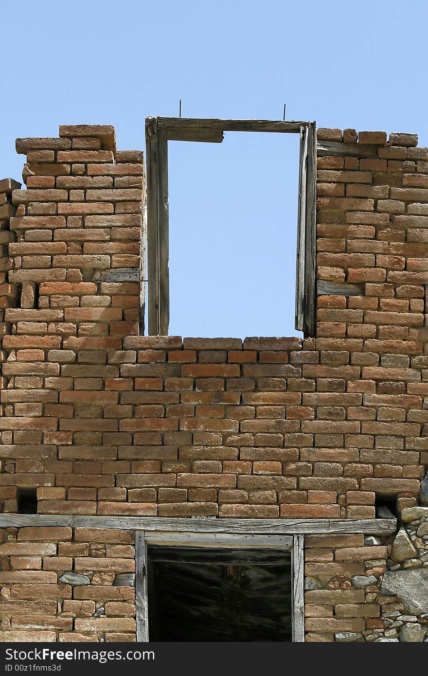 An old wall with a frame window. An old wall with a frame window