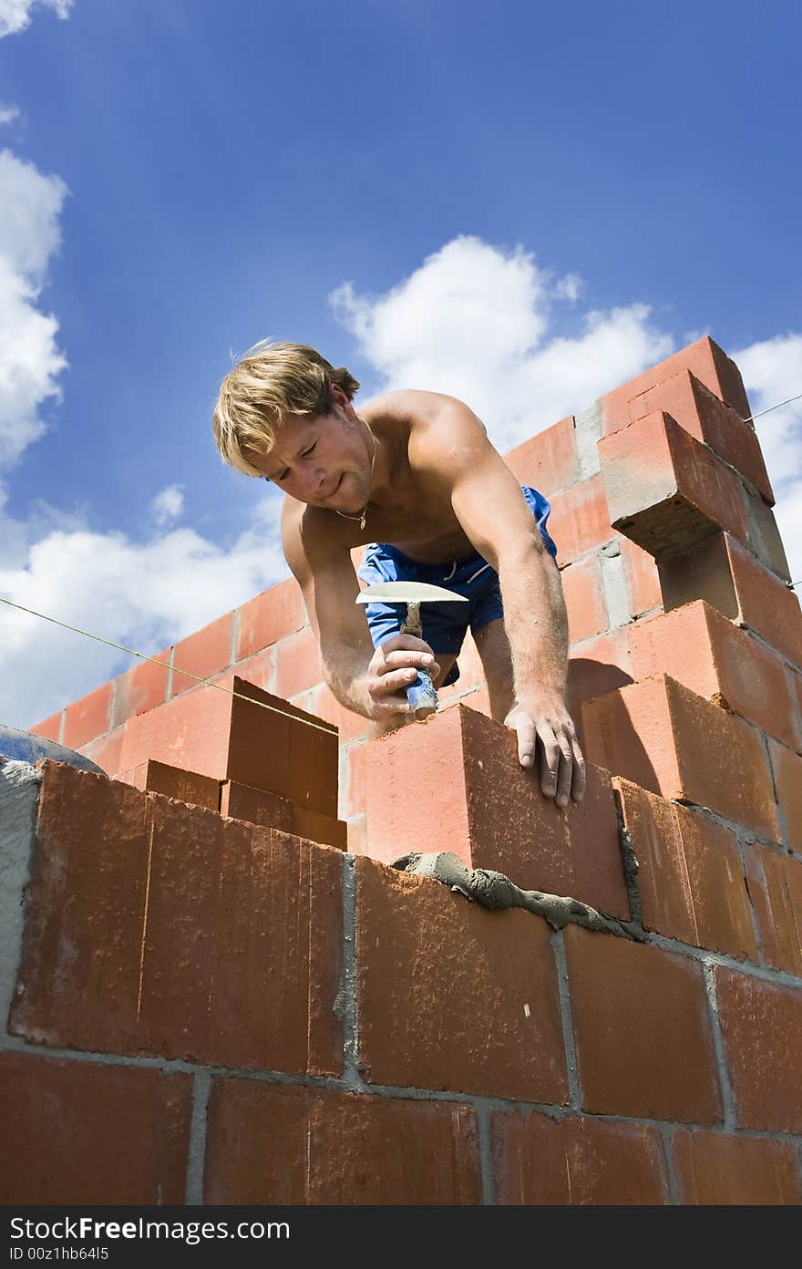 Construction Worker Building A Wall