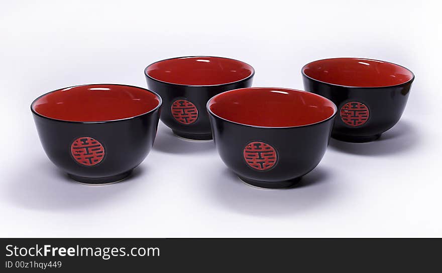 Black clay cups from China on a white background