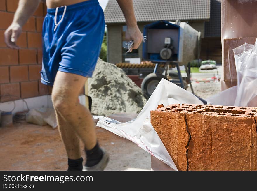 Close up of a brick on a construction site.