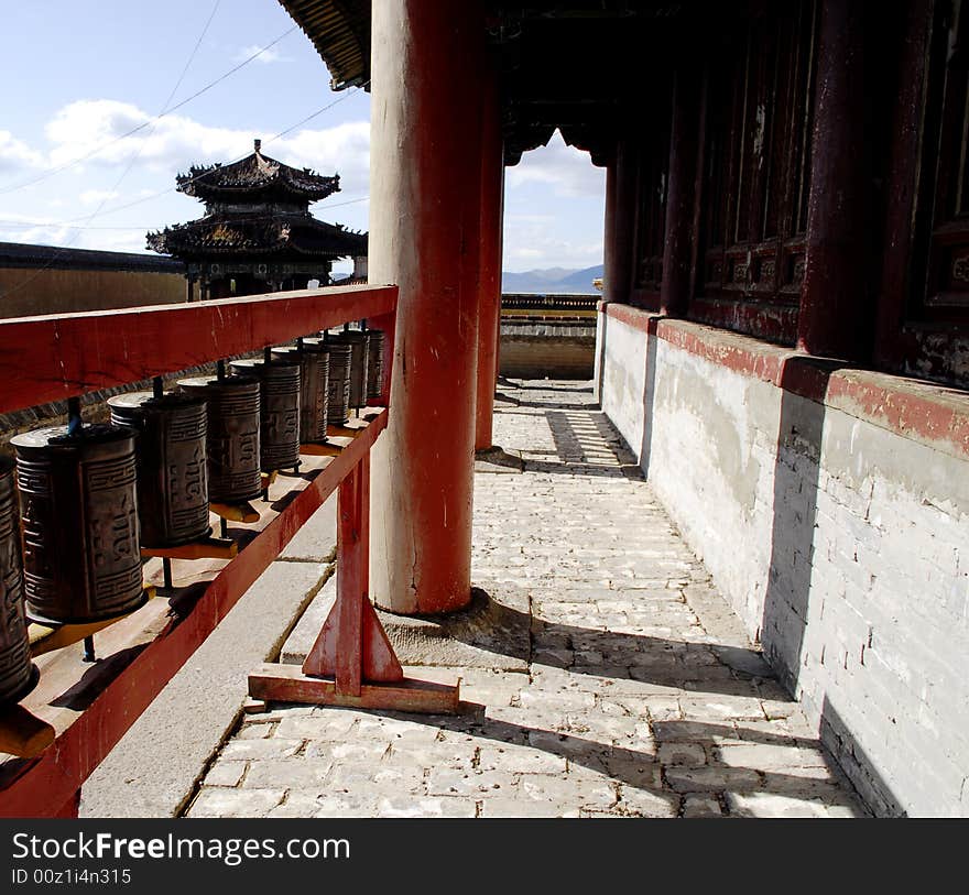 A wide angle view of prayer wheels along one wall of the main temple inside Amarbayasgalant Monastery, one of a handful of Buddhist sites still remaining in Mongolia. A wide angle view of prayer wheels along one wall of the main temple inside Amarbayasgalant Monastery, one of a handful of Buddhist sites still remaining in Mongolia