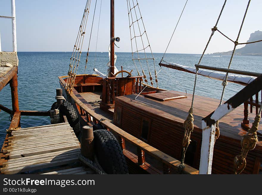 Ship at moorage ashore sea. Ship at moorage ashore sea