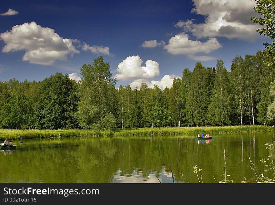 Landscape with blue sky, clouds, forest and lake. Landscape with blue sky, clouds, forest and lake