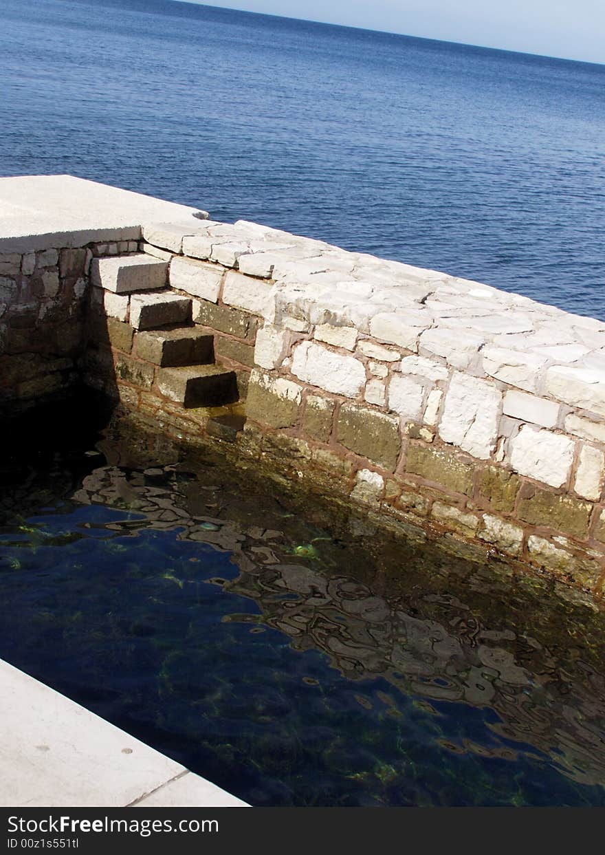 Seaside, white stone quay with stone steps towards the blue sea

*RAW format available. Seaside, white stone quay with stone steps towards the blue sea

*RAW format available