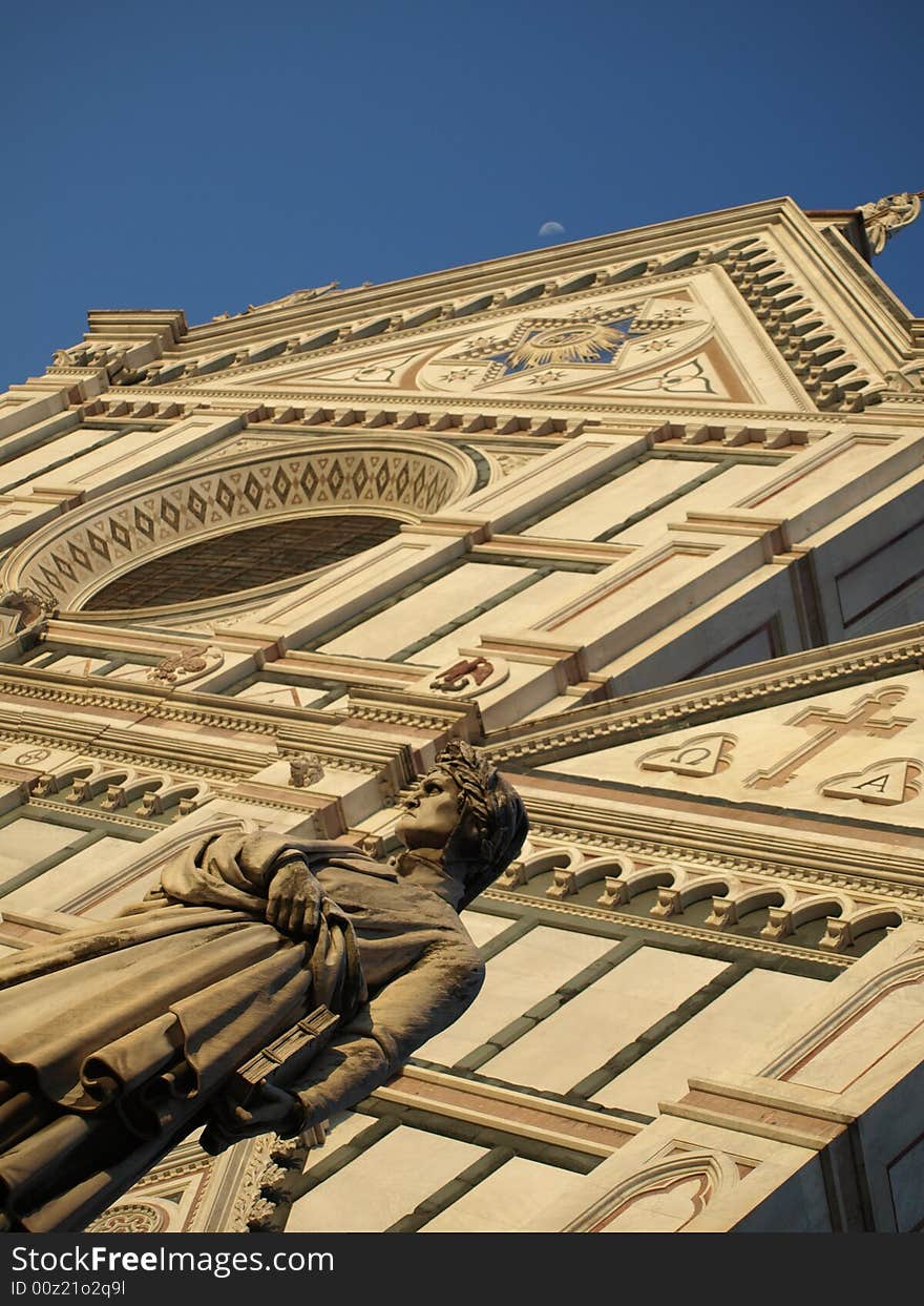 A wonderfull shot of the statue of Dante Alighieri and santa croce church in florence - Italy. A wonderfull shot of the statue of Dante Alighieri and santa croce church in florence - Italy