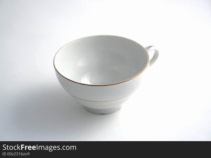 Empty cup of tea on the table in studio. Empty cup of tea on the table in studio