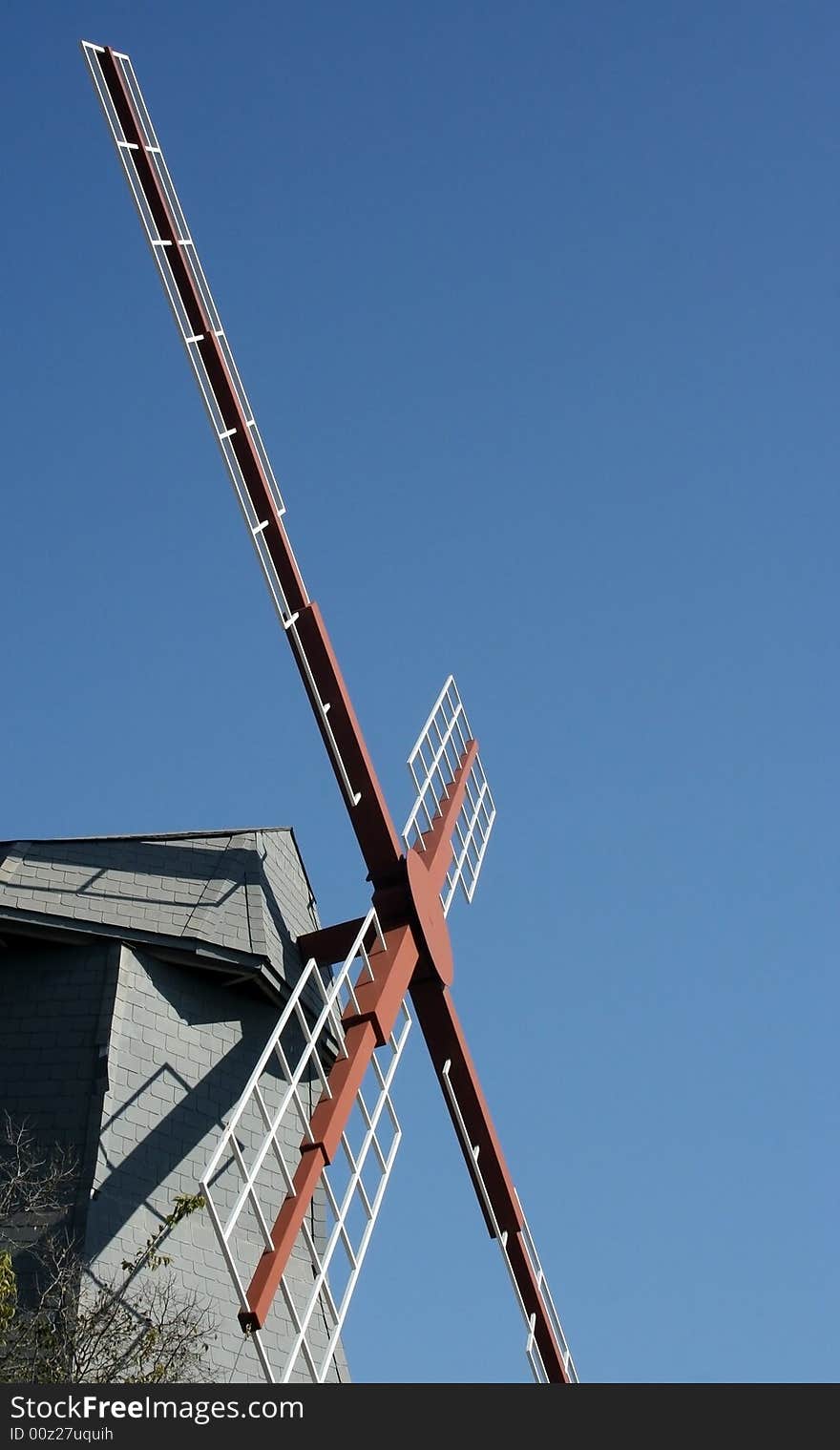 Netherlands style wind mill attached to farm house. Netherlands style wind mill attached to farm house