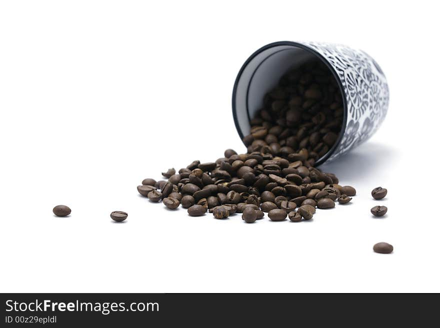 Cup And Coffee Beans Focus On Beans isolated on white backround. Cup And Coffee Beans Focus On Beans isolated on white backround.